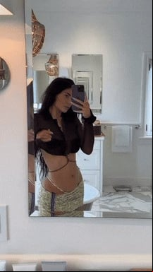 Kylie showing off in the mirror